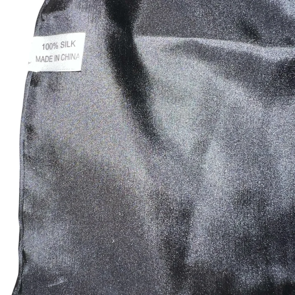 NWOT unbranded oblong black silk scarf with rolled edges, excellent quality